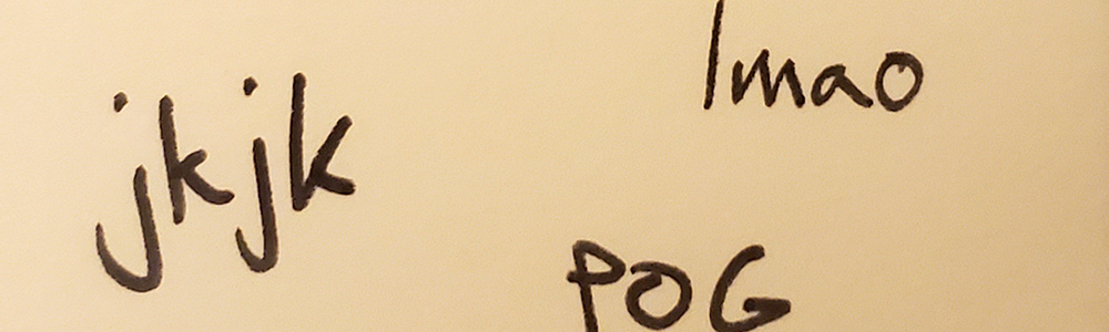 Internet slang written on a post-it note.