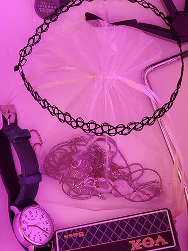 A mix of jewellery and small music equiment.